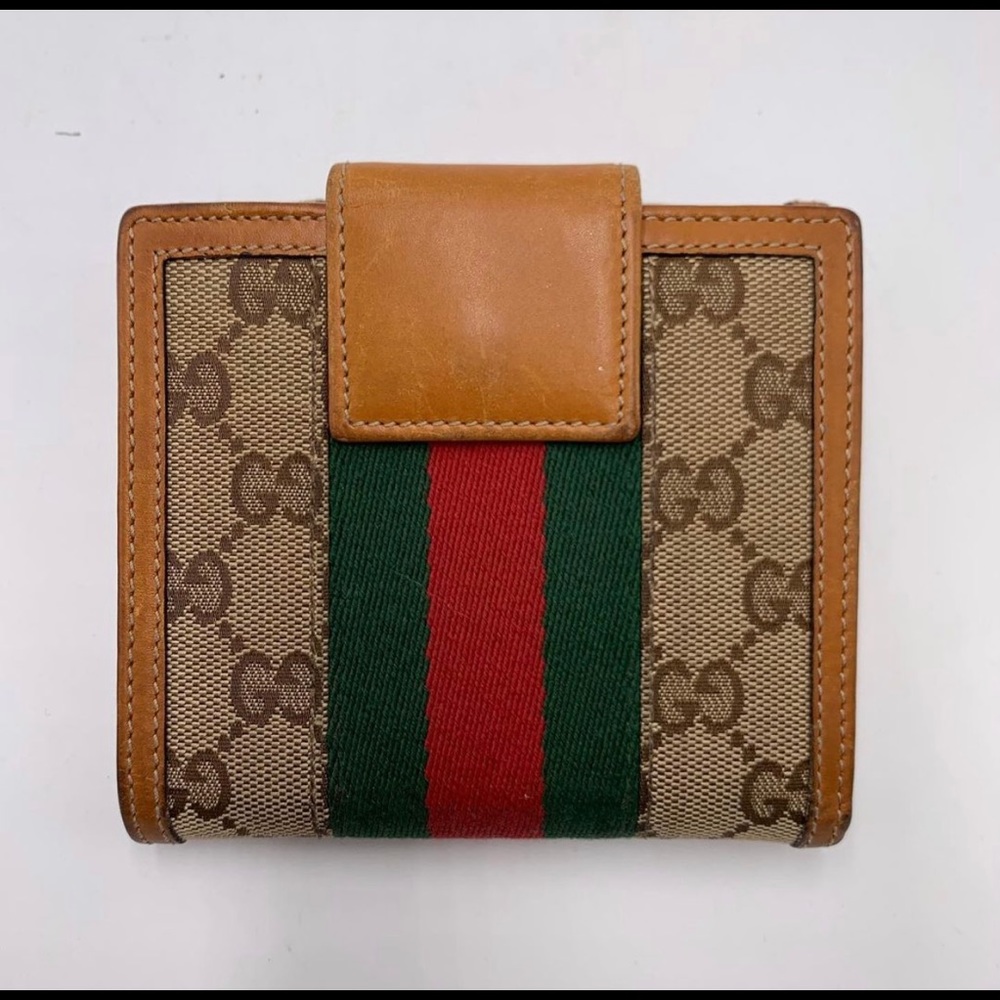 Iconic monogram Gucci wallet  Gucci buckle
